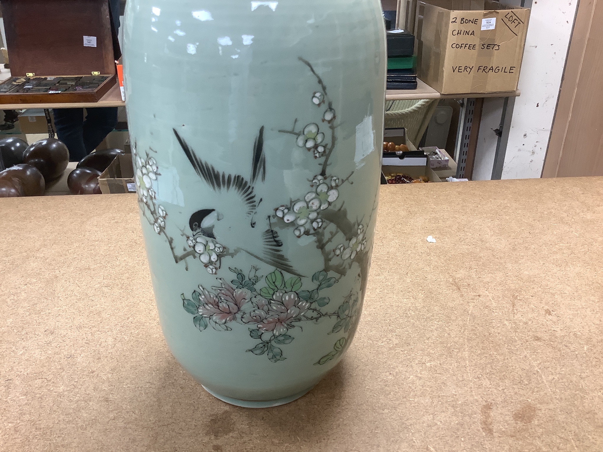 A pair of 19th century Japanese celadon glazed vases (drilled) with hardwood stands, total height 31cm